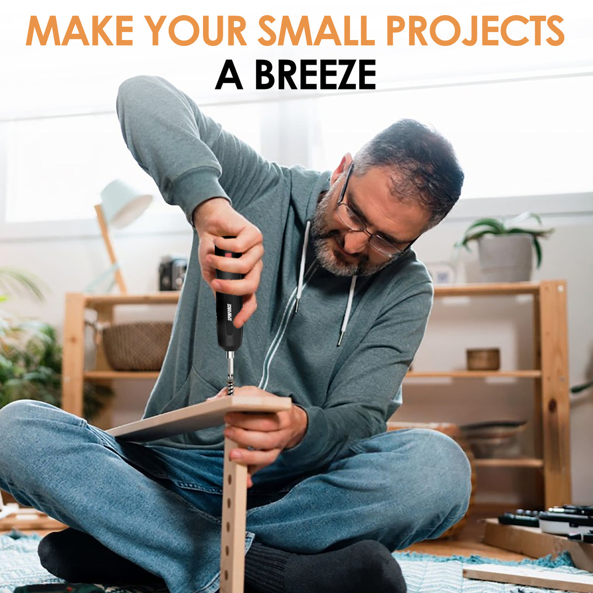 A person assembling wooden furniture at home with a SpinForce cordless screwdriver.